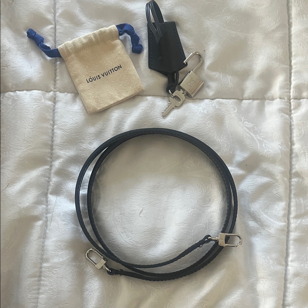 Louis Vuitton Silver Lock & Key, 42” Black Bag Strap and small dustbag for lock